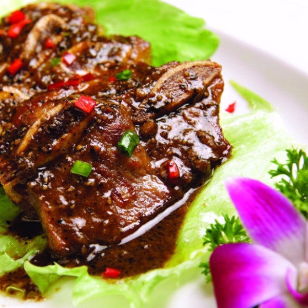 Sizzling beef short ribs with black pepper / honey garlic sauce - Restaurant PM